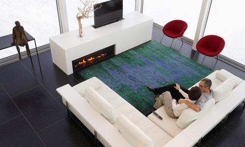 aop version 25 caucasian couple sitting on sofa in modern living room