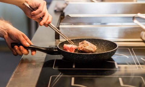 best nonstick cookware man cooking steak