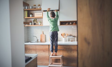 things every tiny apartment needs storage lighting stealing cookies from the kitchen cabinet