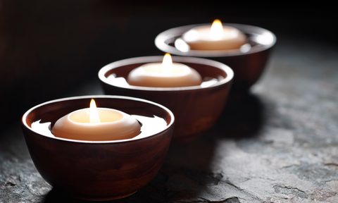 best floating candles for water and pool three lit in wooden bowls filled with