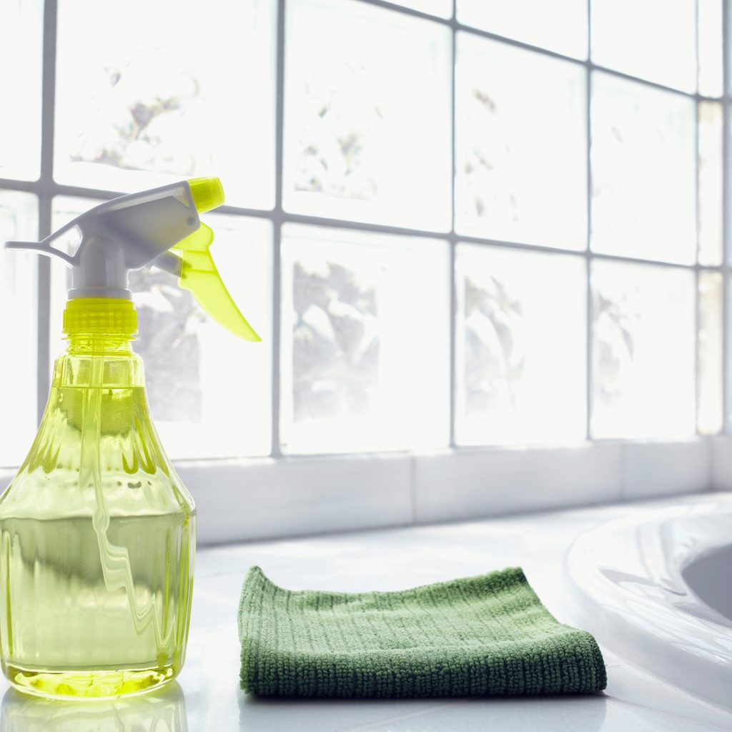 cleaning solution and cloth on coutnertop