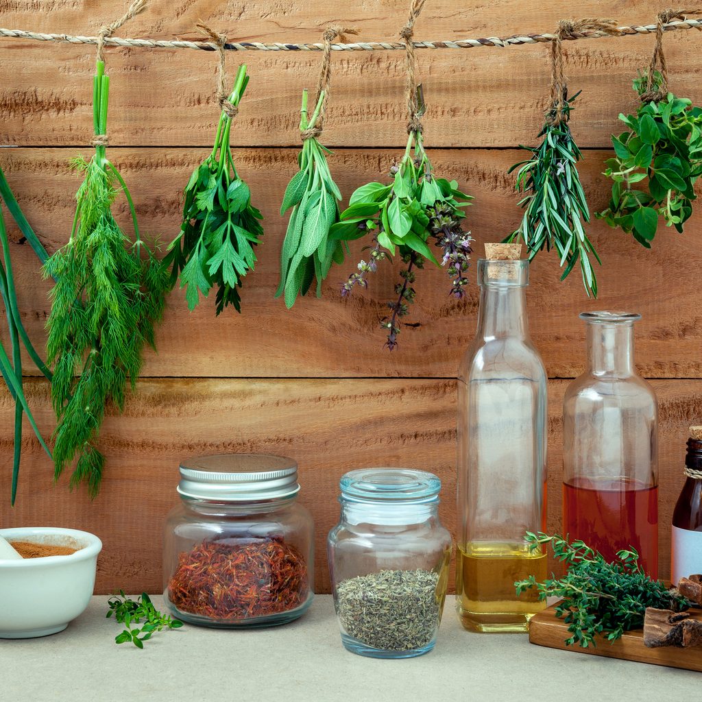 Herbs drying above shelf