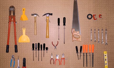 best garage door keypads for keyless opening tools hanging on pegboard
