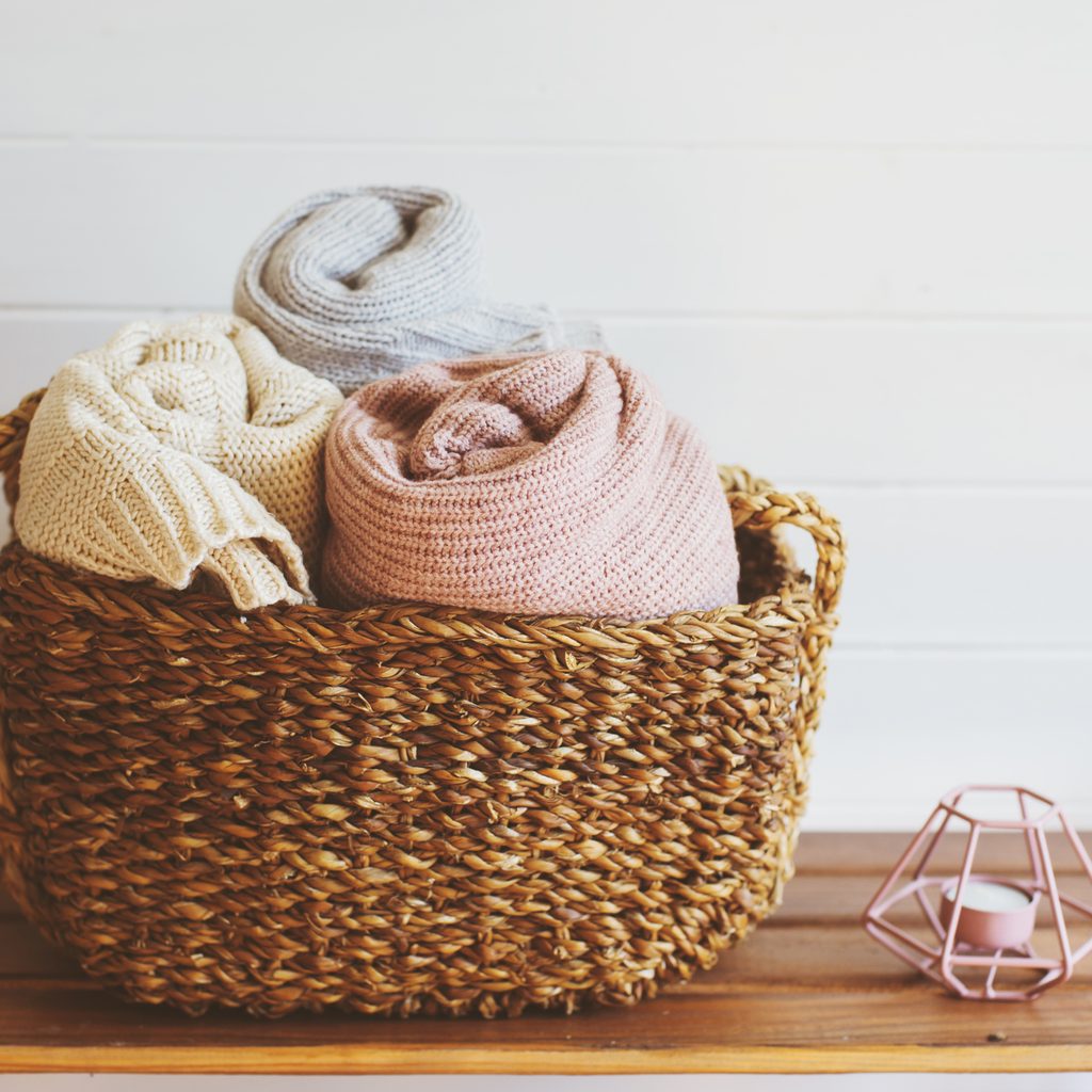 Cozy blankets in a wicker basket