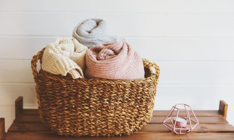 Cozy blankets in a wicker basket