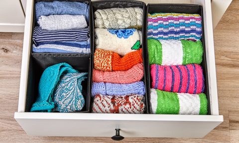 organized drawer with clothing items rolled up