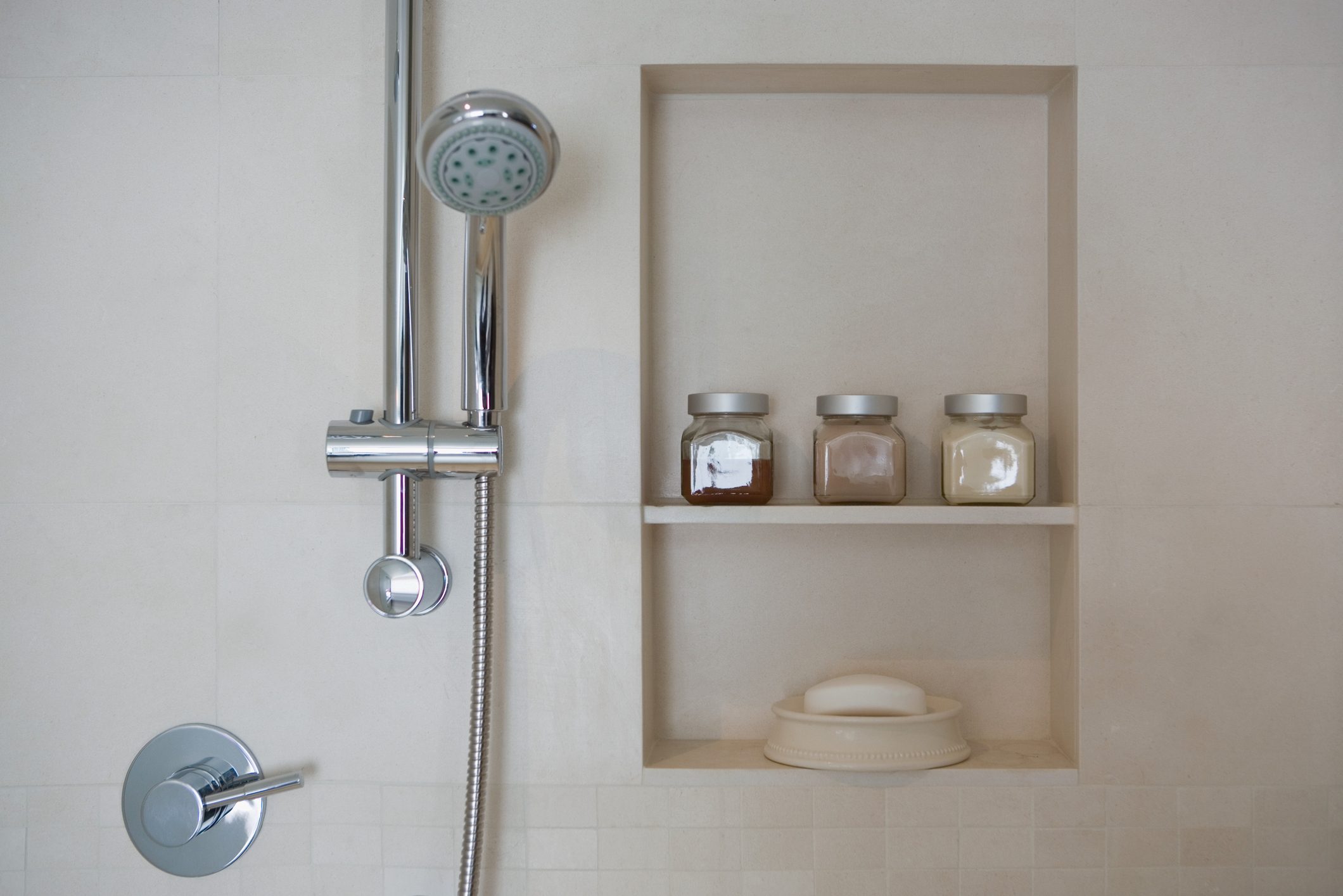 shower head next to shower niche