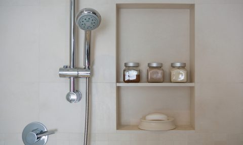 Shower head next to shower niche
