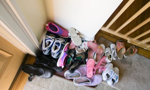 pile of shoes by door