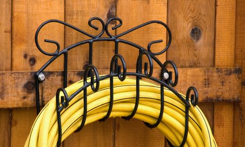 Garden hose on wrought iron hanger