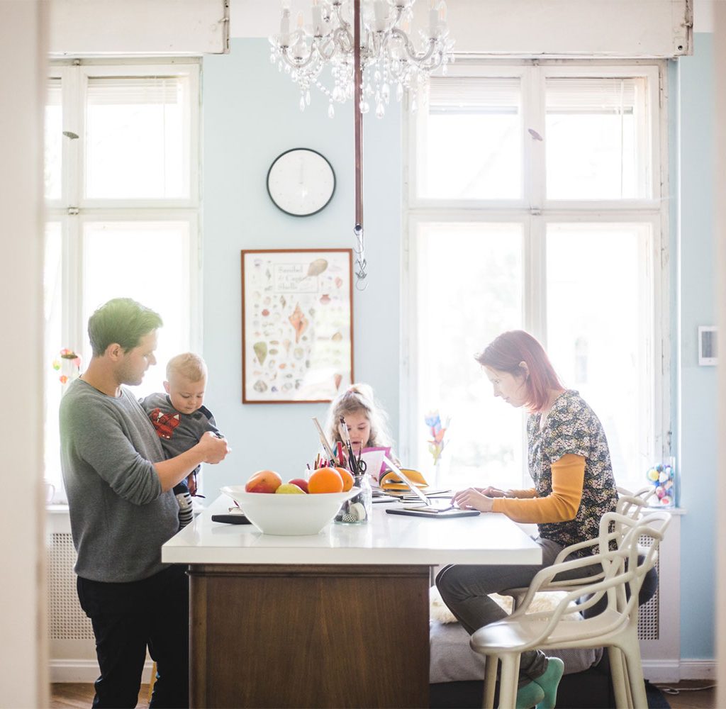 family enjoying time in kitchen