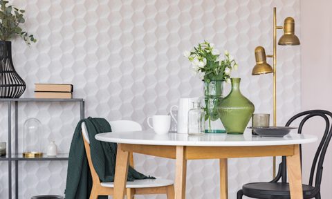 Graphic wallpaper behind small kitchen table