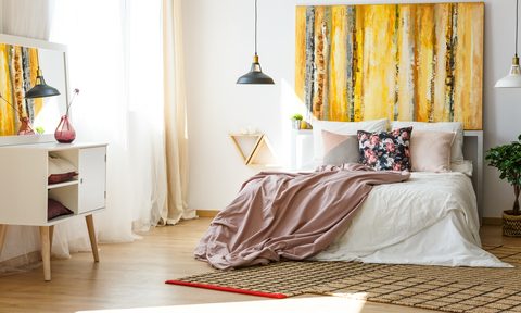 room with yellow painting on wall