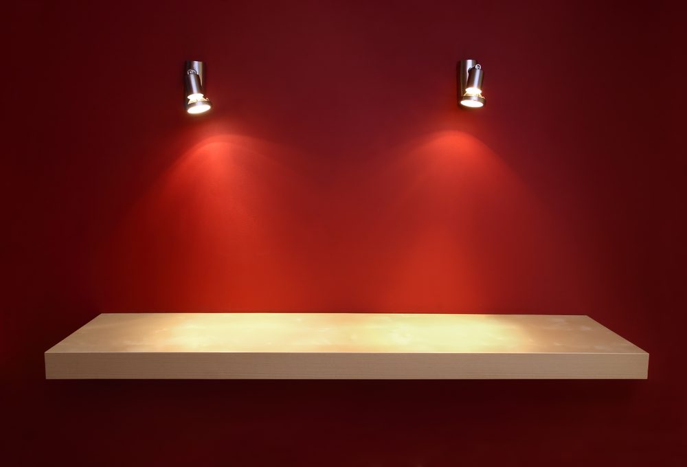 two picture lights for painting on red wall