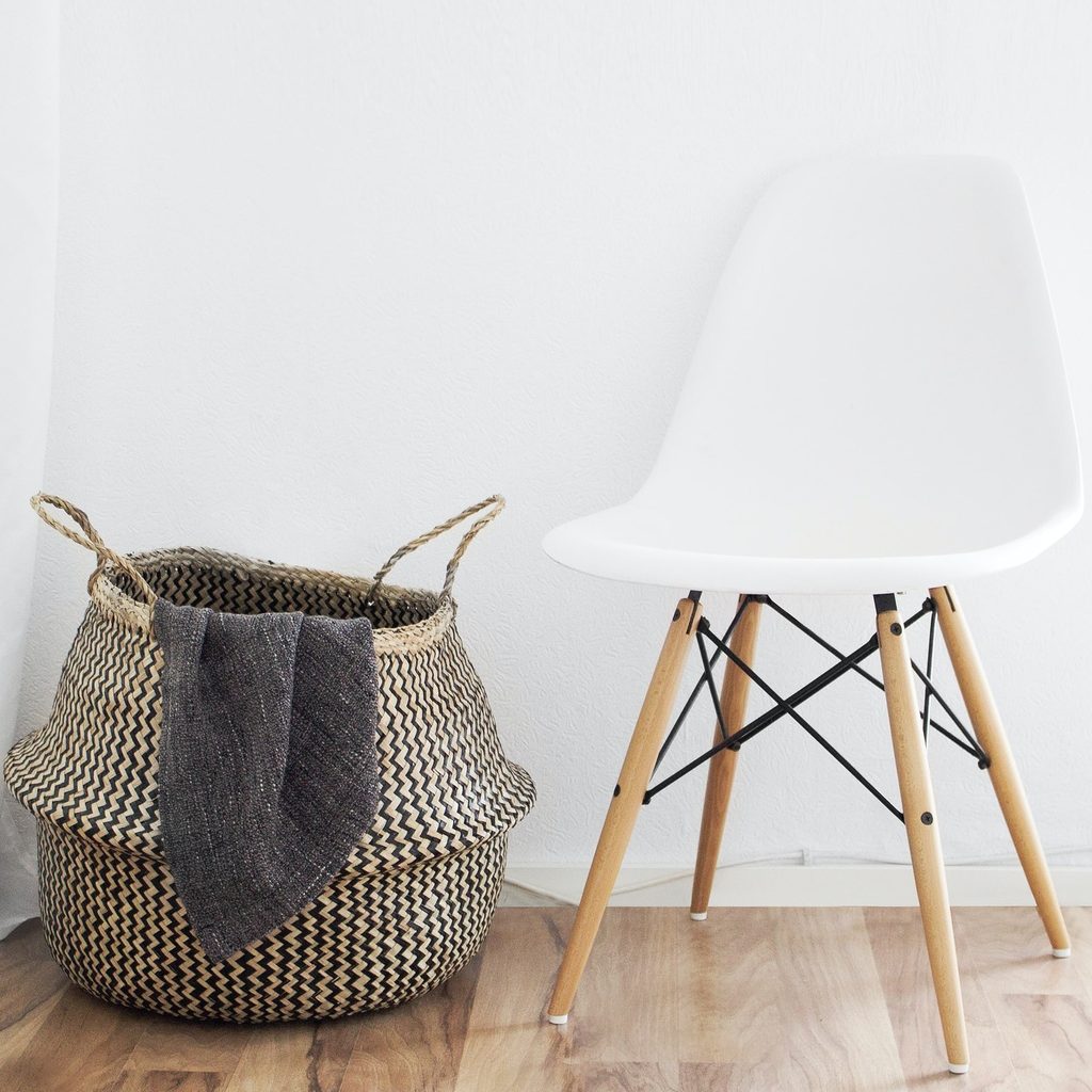 Chair with wicker basket on a hardwood floor