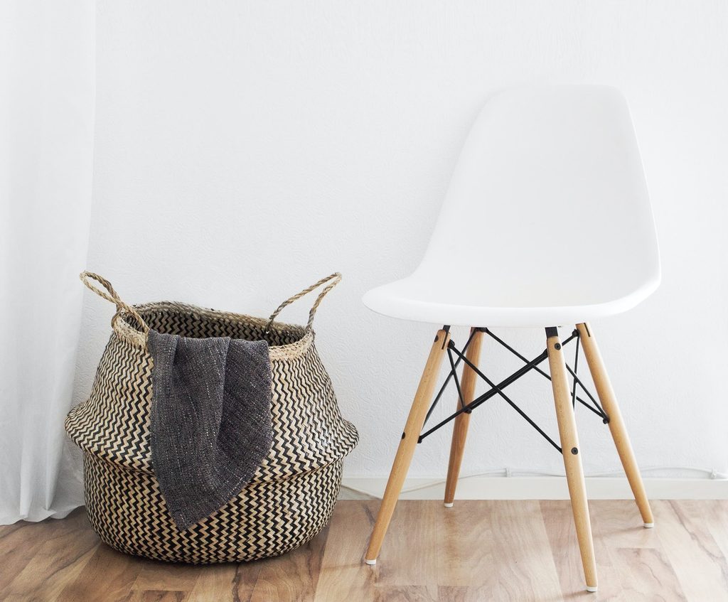 Chair with wicker basket on a hardwood floor