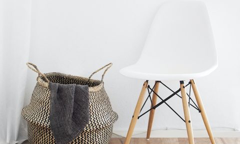 Chair with wicker basket on a hardwood floor