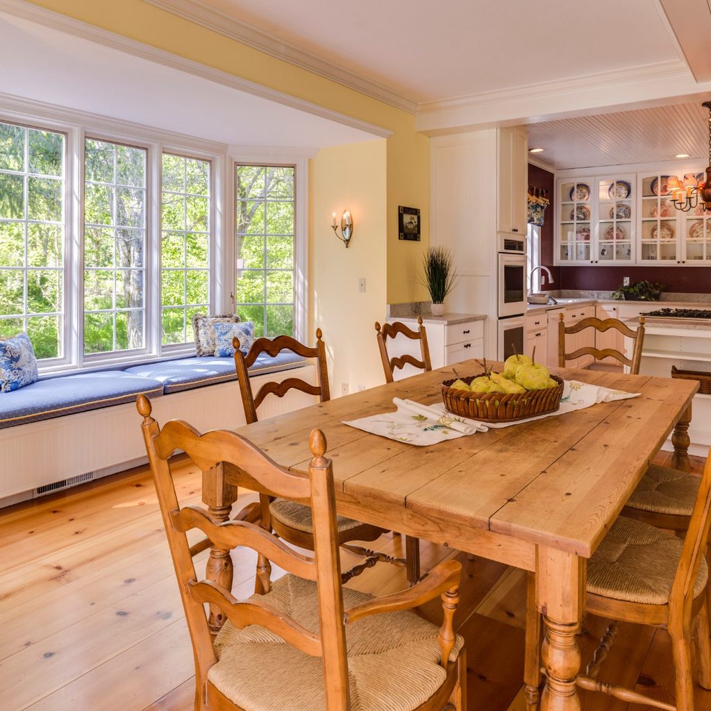 Sunny Country Kitchen with Wooden Table, Chairs, and Floor