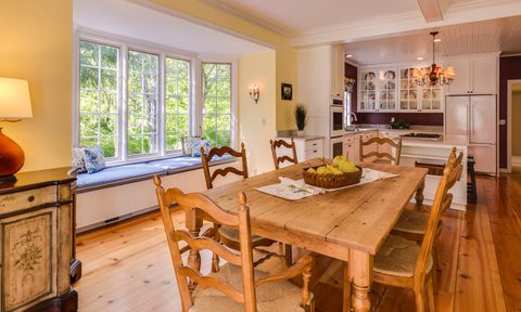 Sunny Country Kitchen with Wooden Table, Chairs, and Floor