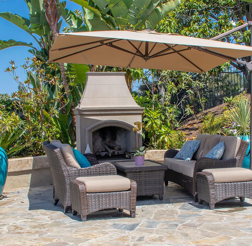 Patio with seating area and fireplace