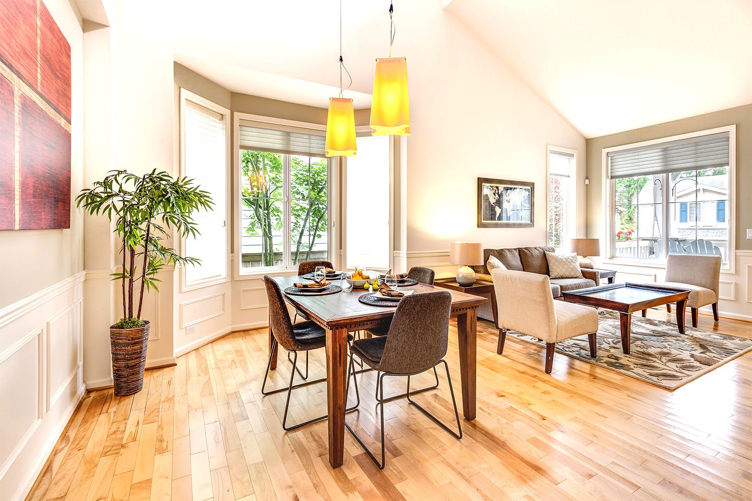 dining and living area with wood floors