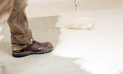 Person painting garage floor