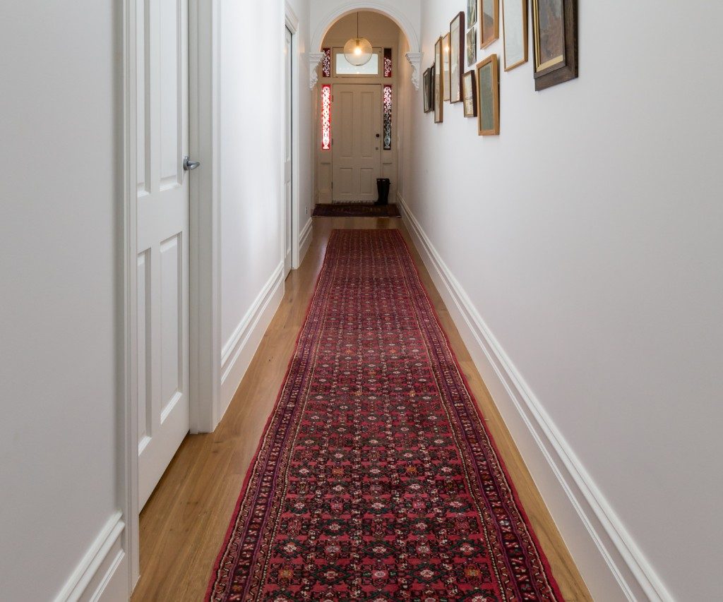 Long rug in hallway of home