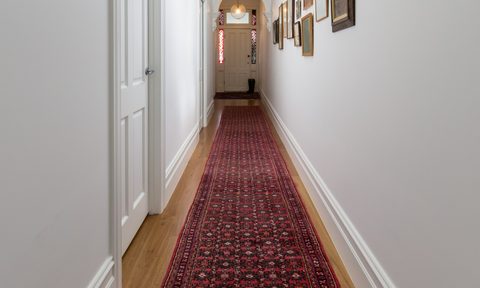 Long rug in hallway of home