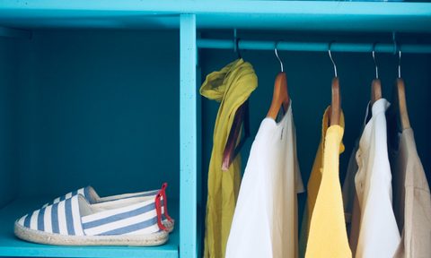 Clothes hanging neatly in closet