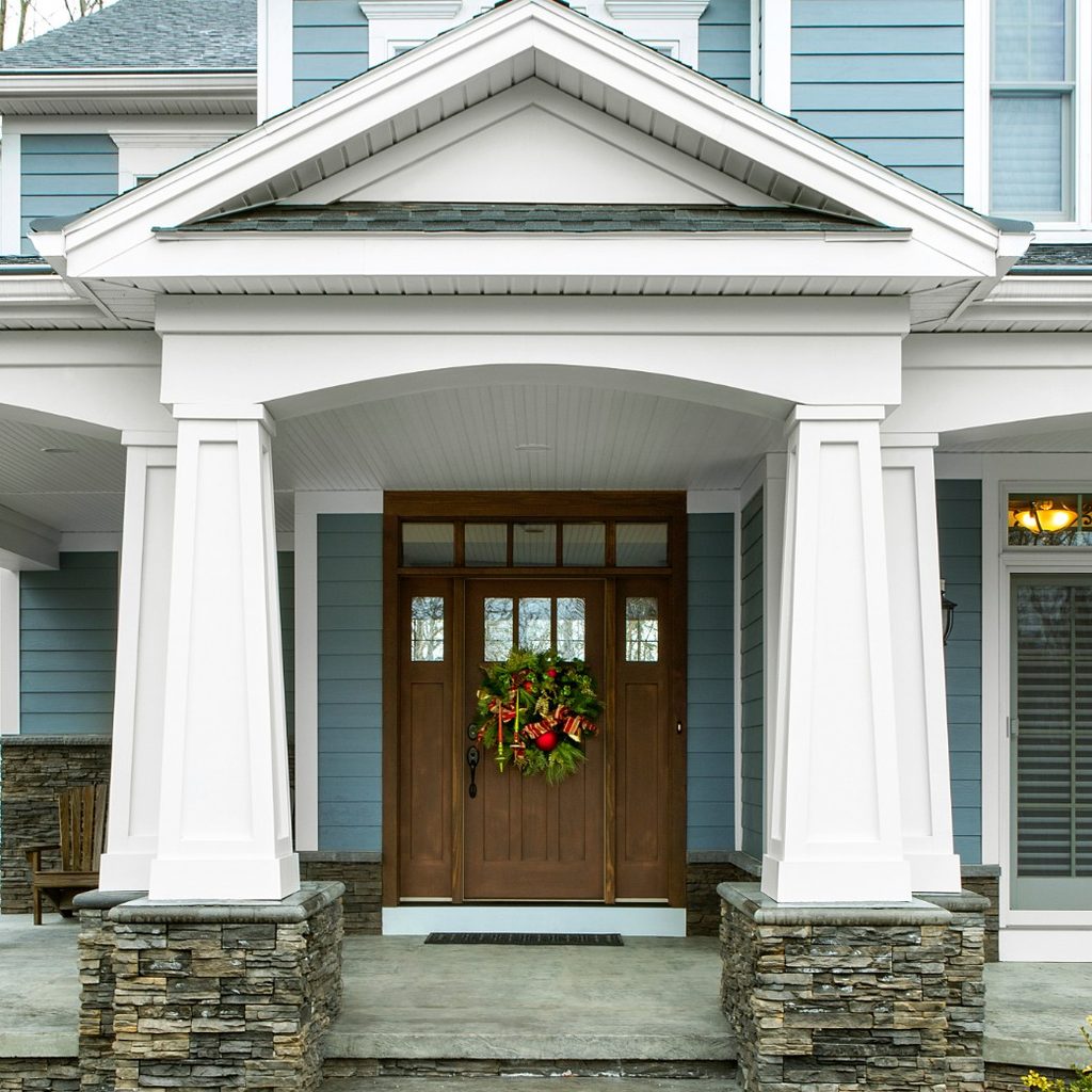 Large blue house with porch