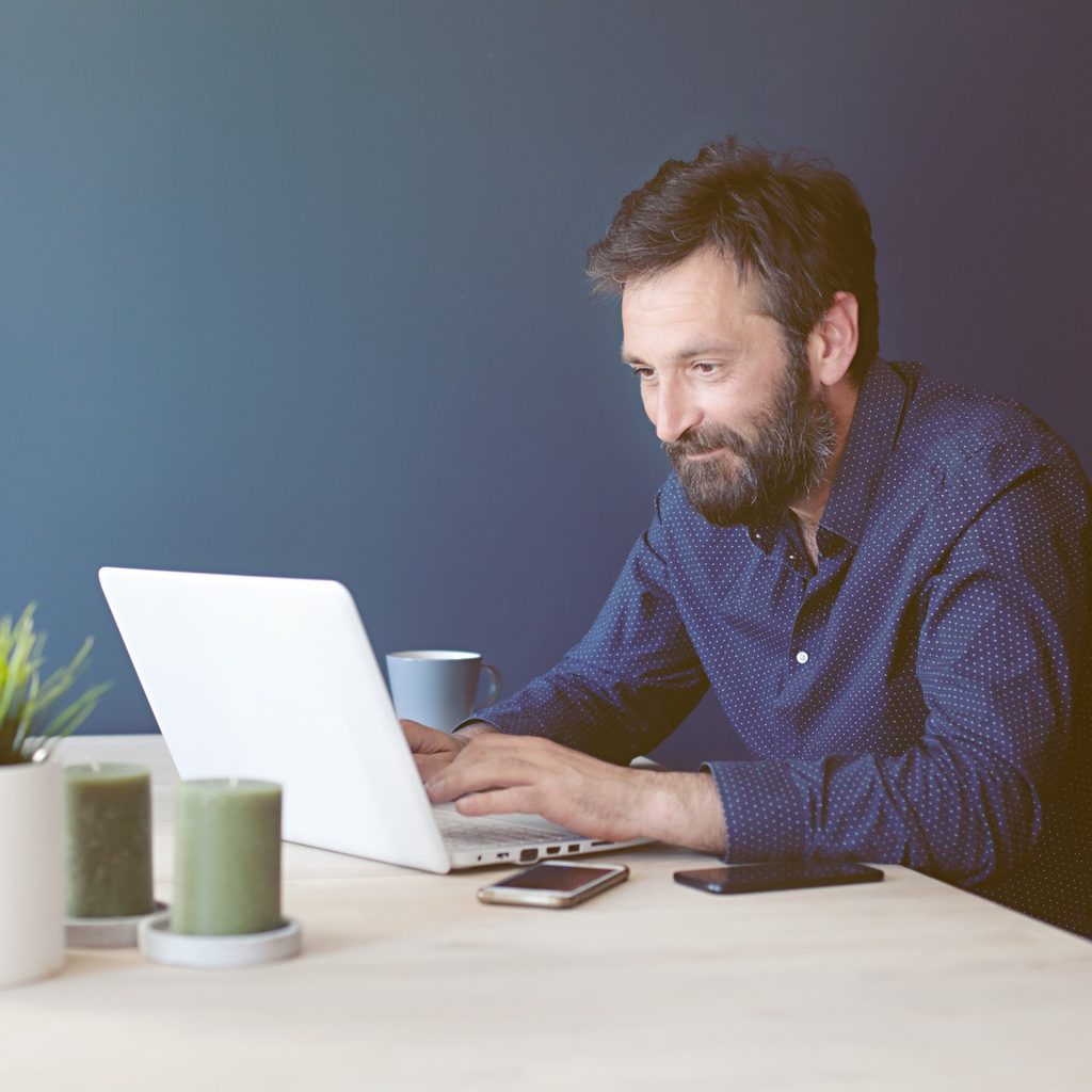 Man at desk working from home