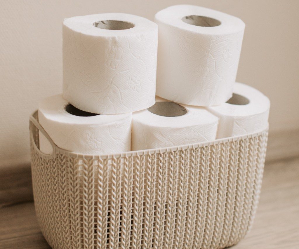 Wicker basket holding toilet paper