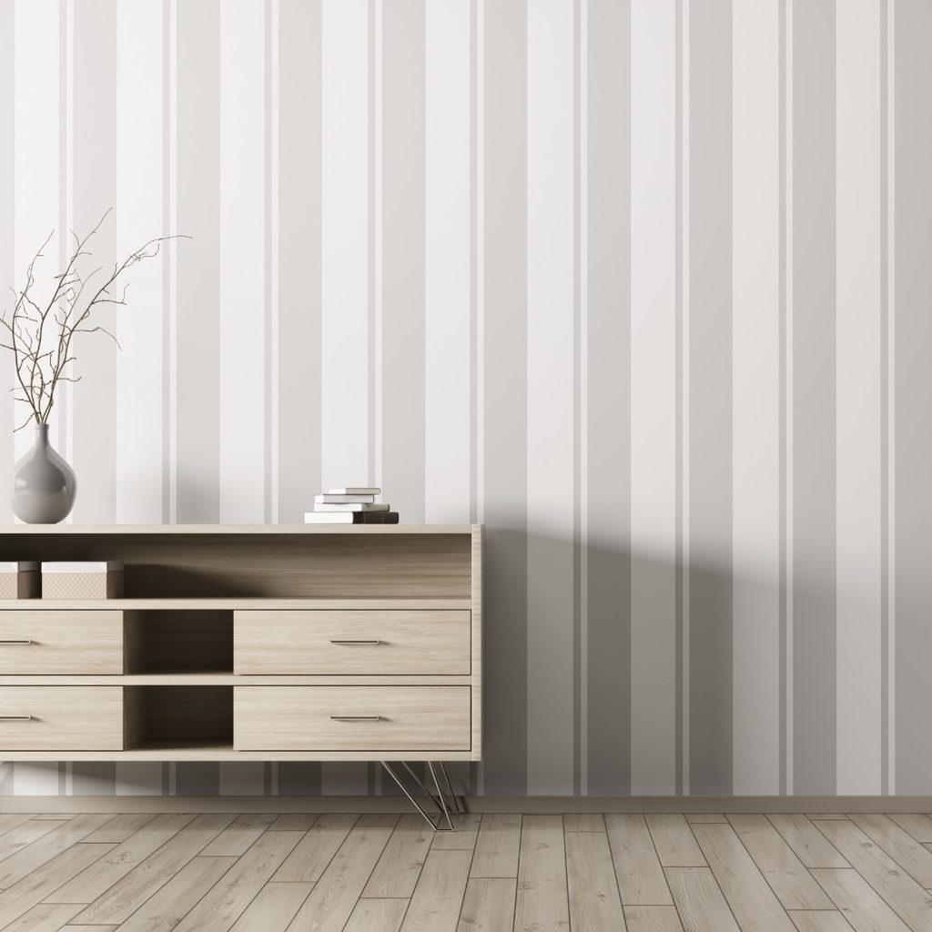 Gray vertical wallpaper in room