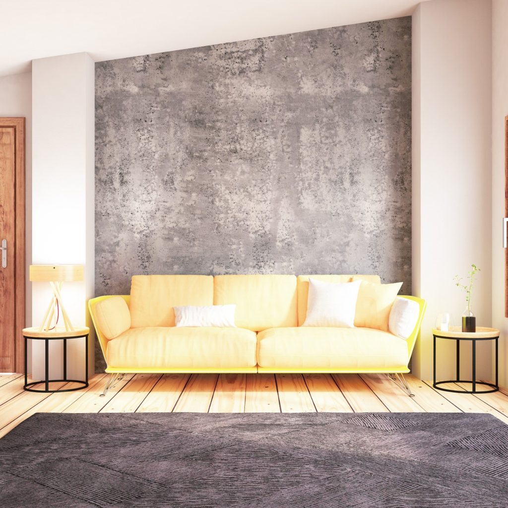 Modern living room with yellow couch and gray rug