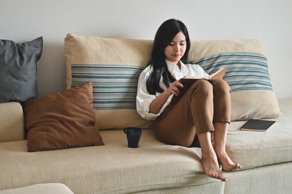 woman reading on the couch