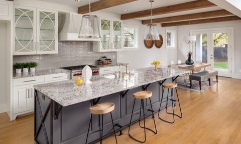 Large dining room and living room with ceiling beams