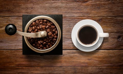 coffee grinder and cup of coffee