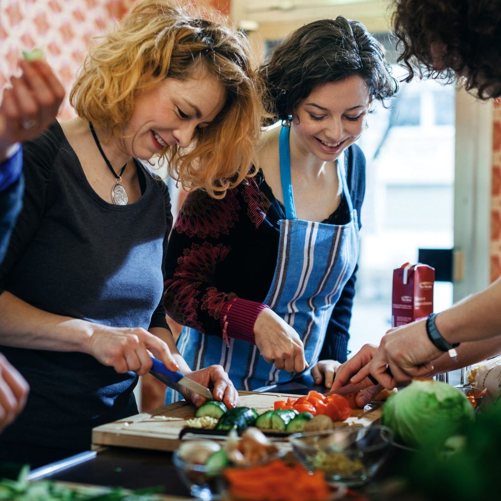 group of people cooking together