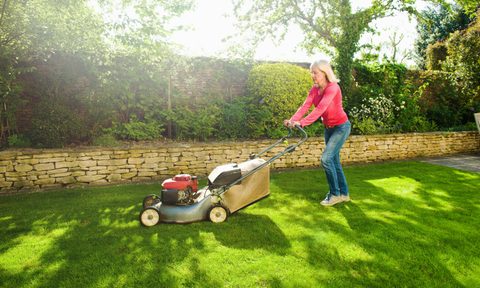 woman cutting lawn