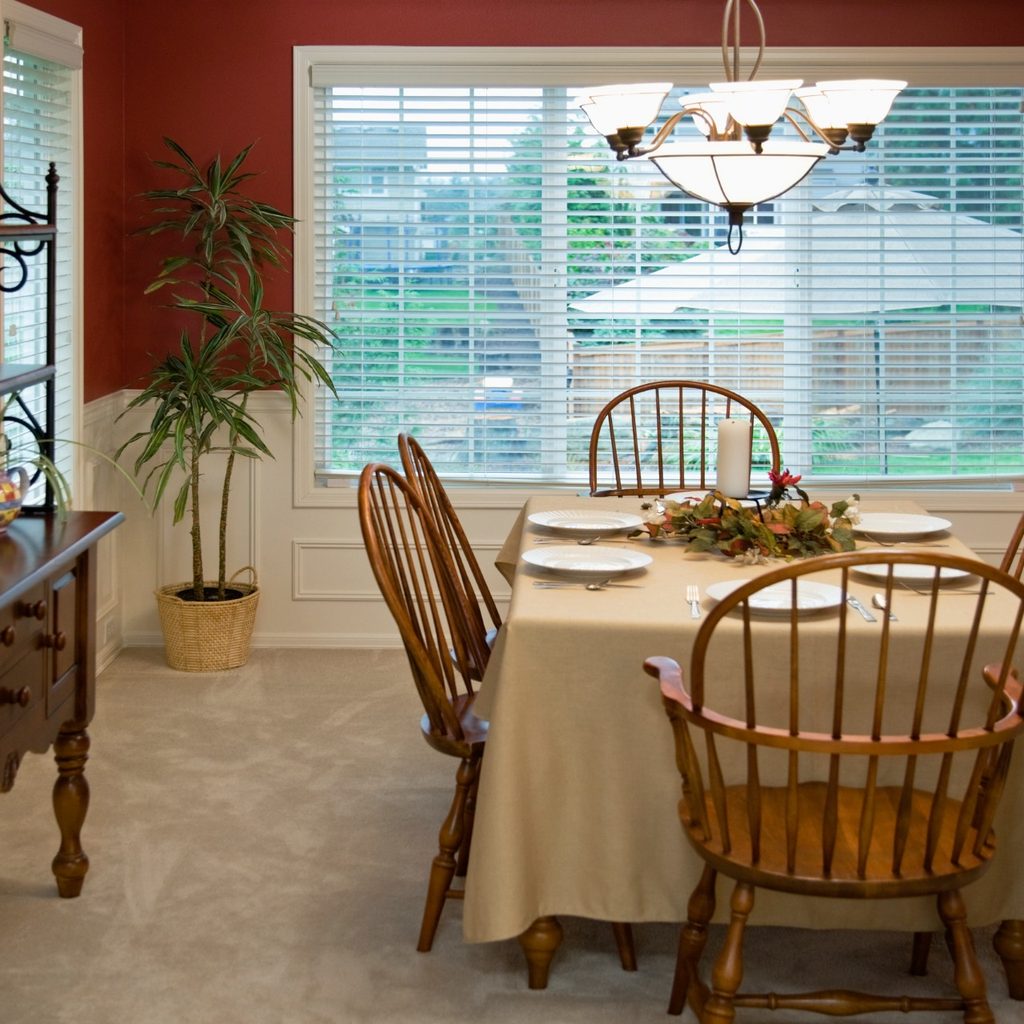 Dining room with red walls and table