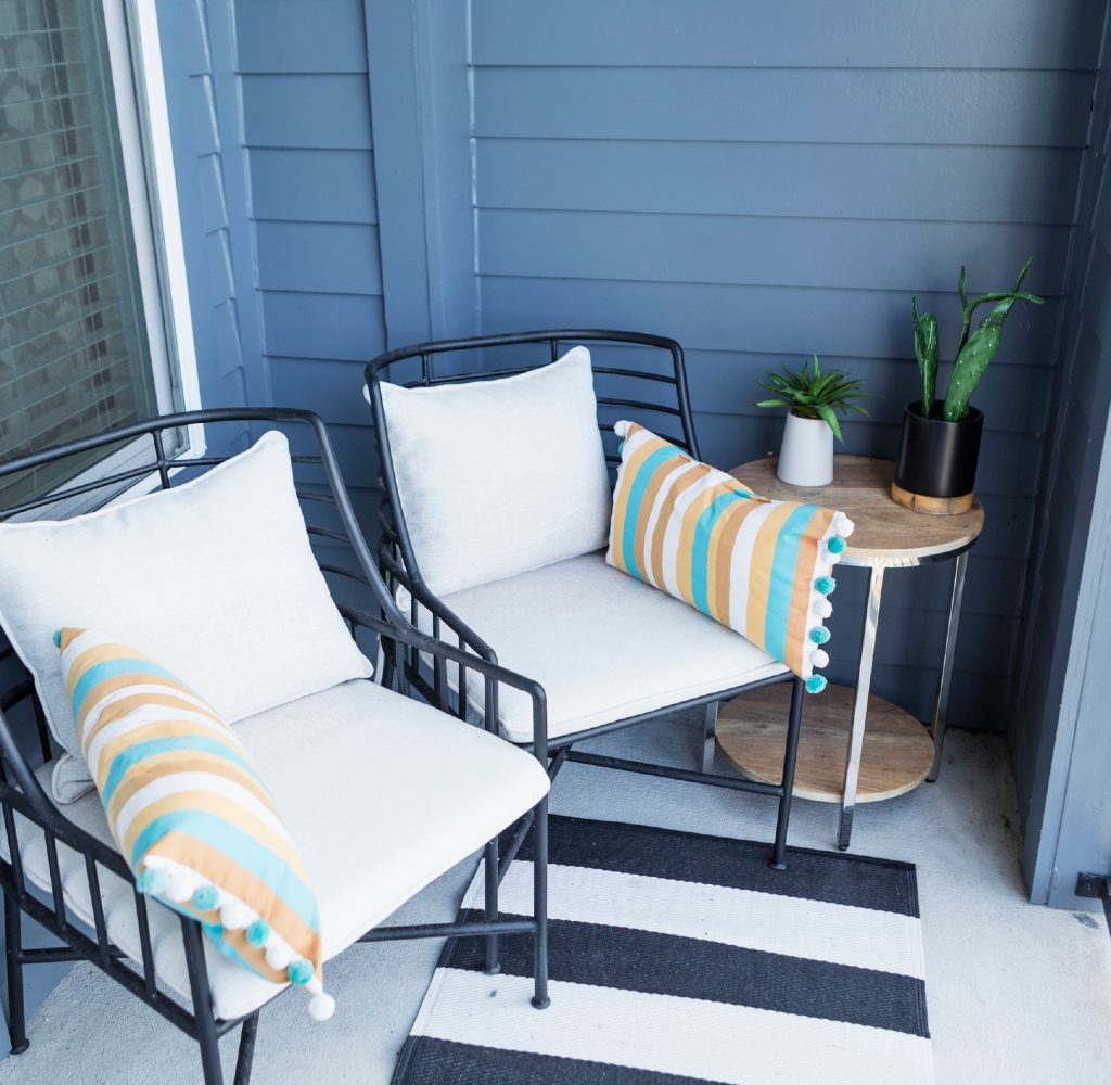 Outdoor seating area with a rug