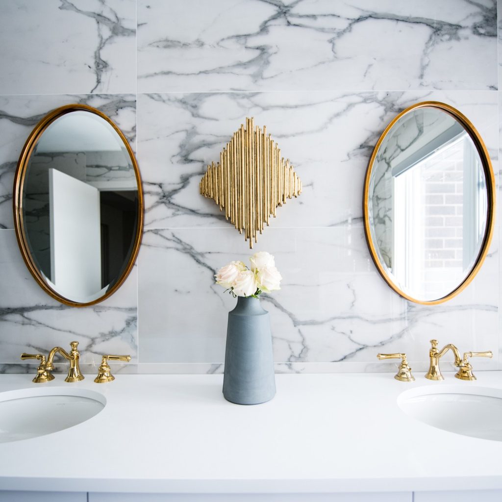 Clean bathroom sink with two mirrors