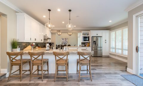 Kitchen island with wooden chairs