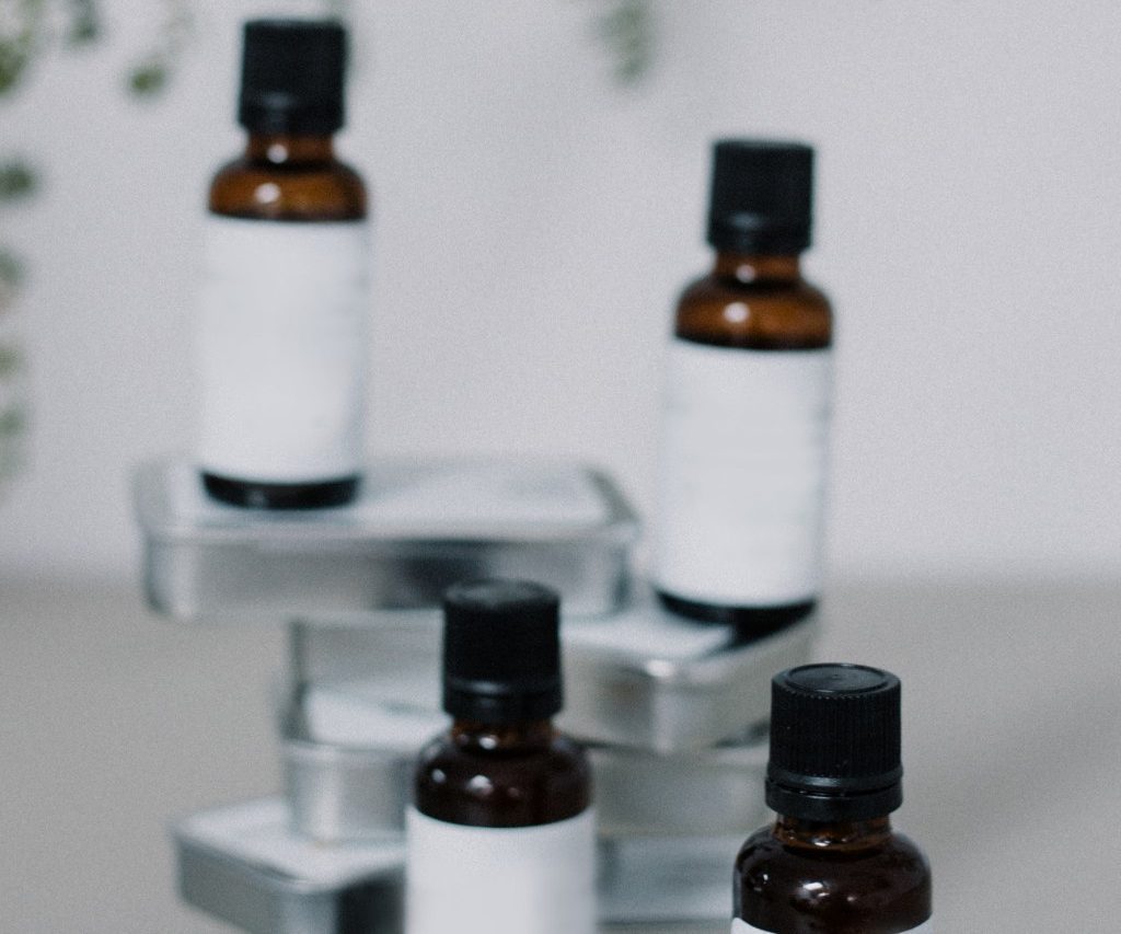 Four stacked bottles of essential oils