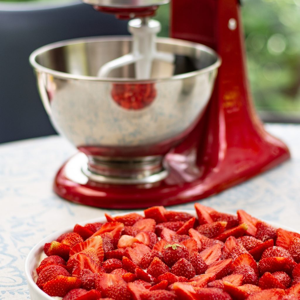 red stand mixer with strawberries