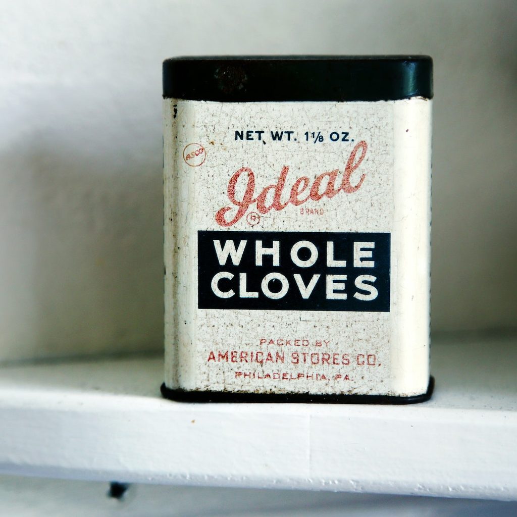 retro clove tin on white shelf