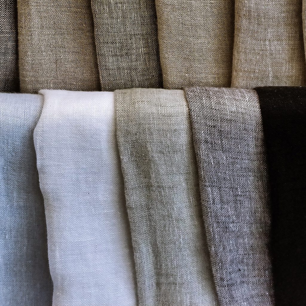 several pieces of linen fabric in different colors