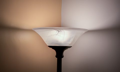 Corner lamp against yellow and white walls