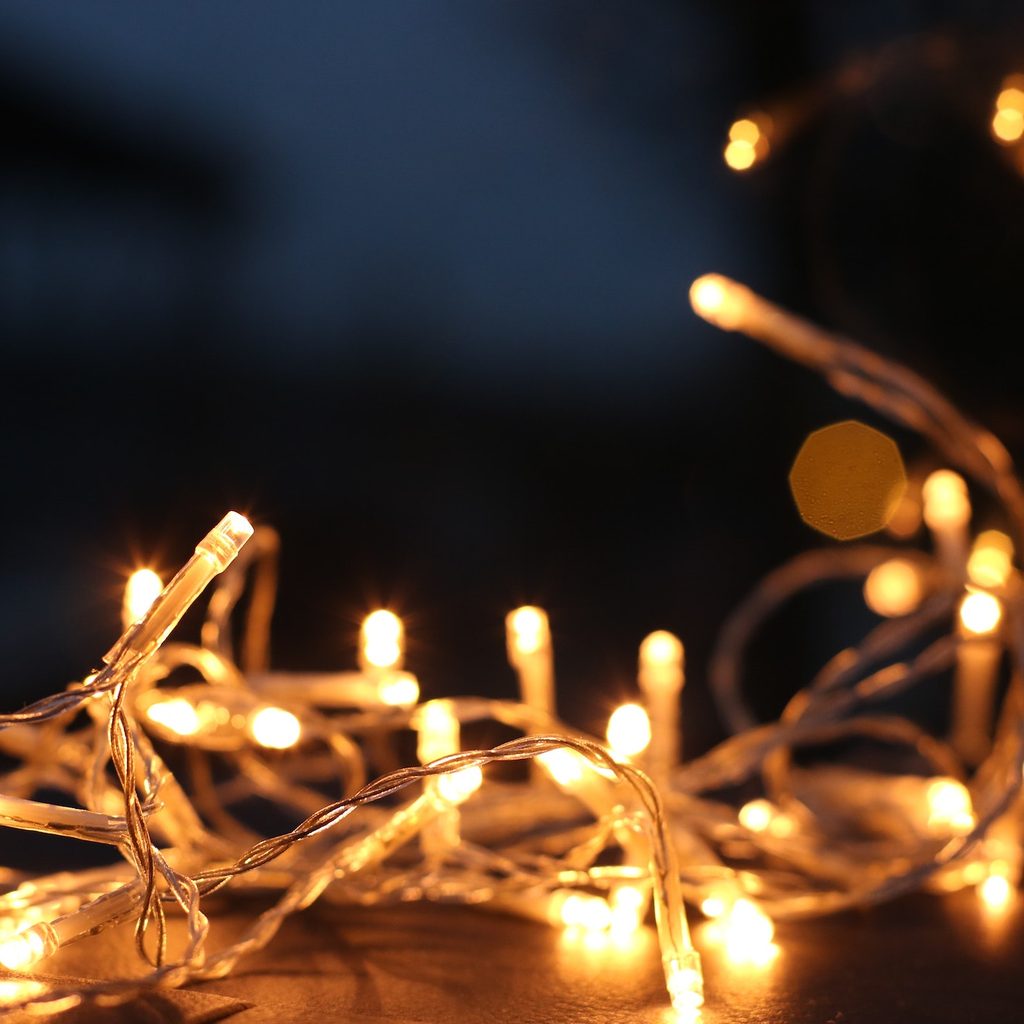 white fairy lights gathered on table