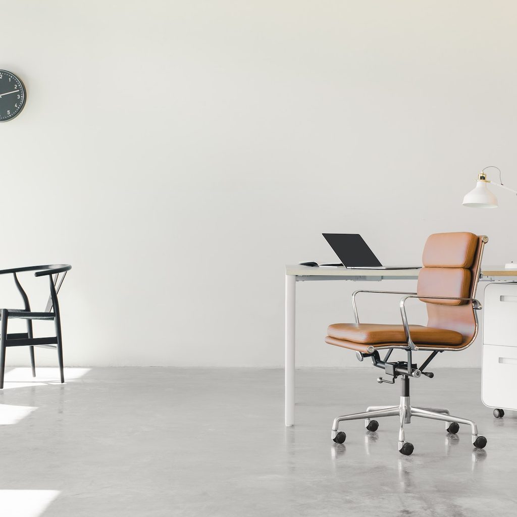 brown desk chair in minimalist office